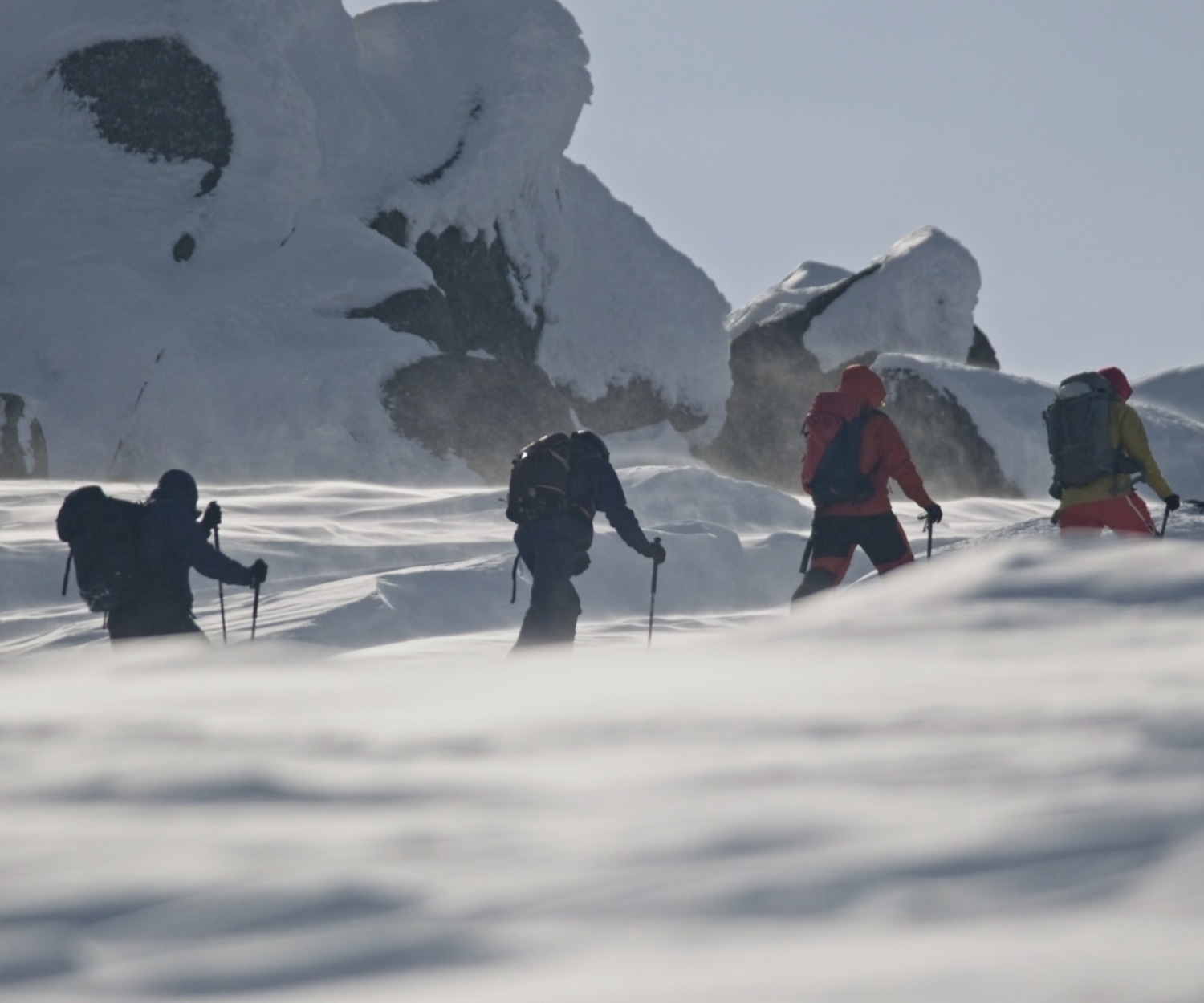 Men trekking in the snow