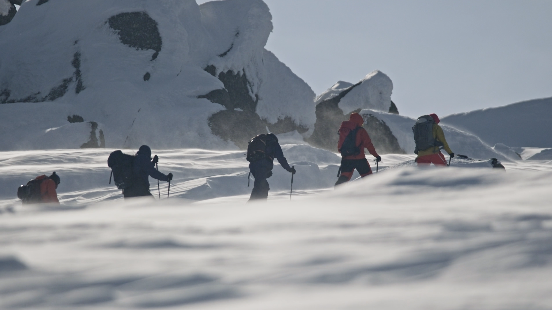 Men trekking in the snow